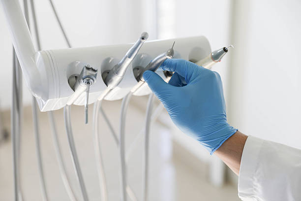 Professional Tooth Extraction technician working in Tontitown, AR